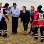 Red Cross workers attend airline passengers who survived a plane crash in a field near the airport in Durango, Mexico, on Tuesday. (Red Cross Durango via AP)
