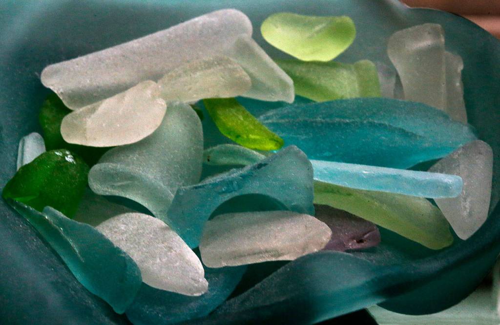 In Linda Smiths seaglass arrangements, it almost looks as if they are tiny fish, birds and seals. (Dan Bates / The Herald)
