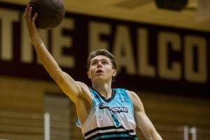Colby Kyle jumps for a layup during the "The CrawsOver" pro-am league game at Seattle Pacific University on Sunday, July 29, 2018 in Seattle, Wa. (Olivia Vanni / The Herald)