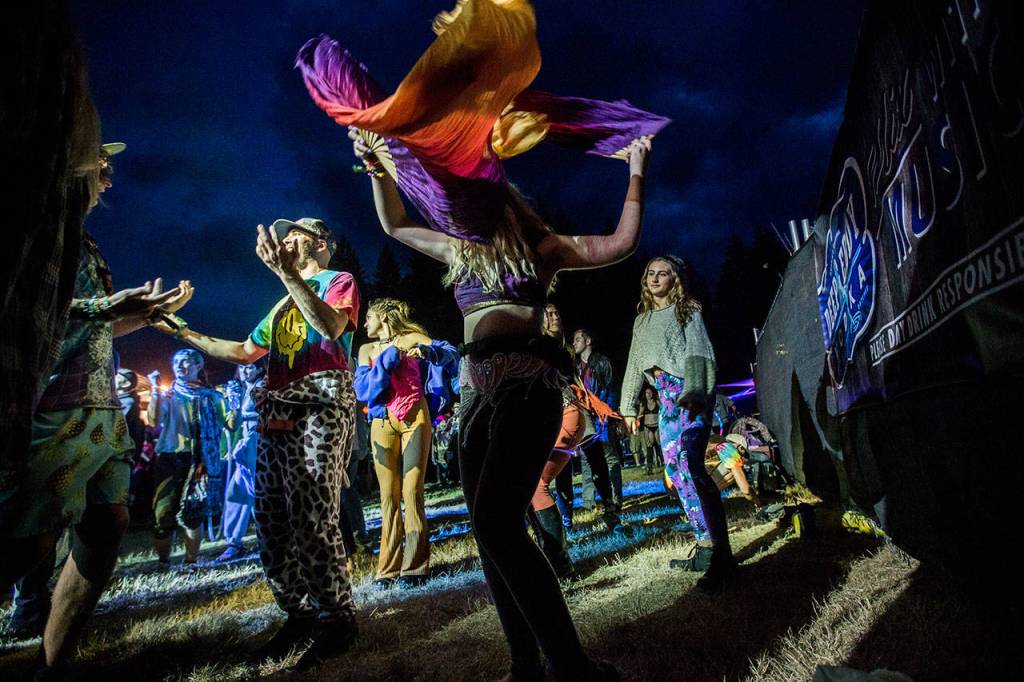 People dance during Twiddles performance at the Summer Meltdown on Thursday in Darrington. (Olivia Vanni / The Herald)
