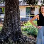 Tracy Rubstello, director of development for the Bridge Receiving Center (background), talks about the home being created as a 30-day refuge for children who are first entering foster care. (Dan Bates / The Herald)