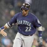 Seattles Robinson Cano rounds third base after hitting a three-run home run during the Mariners May 12 game in Detroit. Sources say Cano will play with the Everett AquaSox on Thursday before rejoining the Mariners on Aug. 14 in Oakland. (AP Photo/Carlos Osorio)