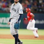 Seattles Felix Hernandez stands on the mound as Texas Adrian Beltre rounds the bases after homering off Hernandez during the sixth inning of the Mariners 11-4 loss to the Rangers on Tuesday in Arlington, Texas. (AP Photo/Brandon Wade)