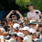 Justin Thomas watches his tee shot on the 15th hole among a crowd of fans during a practice round for the PGA Championship on Wednesday at Bellerive Country Club in St. Louis. (AP Photo/Charlie Riedel)