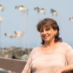 Author Terry Woods, shown here at the Edmonds fishing pier, will talk about her book, Accidental Travels of a Single Woman at Third Place Books in Lake Forest Park on Aug. 22. (Andy Bronson / The Herald)
