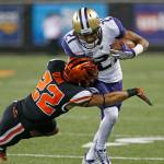 Washington wide receiver Quinten Pounds (21) fends off Oregon State cornerback Isaiah Dunn (22) during a game on Sept. 30, 2017, in Corvallis, Ore. (AP Photo/Timothy J. Gonzalez)