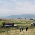 In this 2017 photo, visitors approach a former ranch house and barn during a guided hike on the Rocky Flats National Wildlife Refuge near Denver. (AP Photo/Dan Elliott, File)