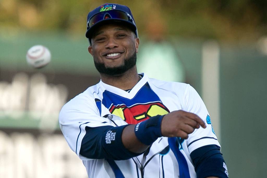 AquaSoxs Robinson Cano tosses a ball after a double play Friday night at Everett Memorial Stadium in Everett on Aug. 10, 2018. (Kevin Clark / The Herald)