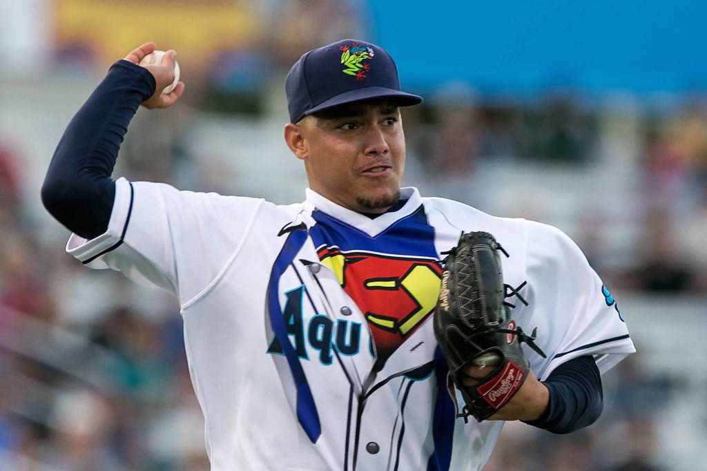 AquaSoxs Carlos Hernandez throw to first base for an out Friday night at Everett Memorial Stadium in Everett on Aug. 10, 2018. (Kevin Clark / The Herald)