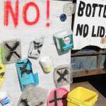 A board displays plastic containers refused at Island Recycling in Freeland. It takes containers marked with the recycling symbol No. and No. 2, which include water, juice and milk and other bottles. (Patricia Guthrie / Whidbey News Group)