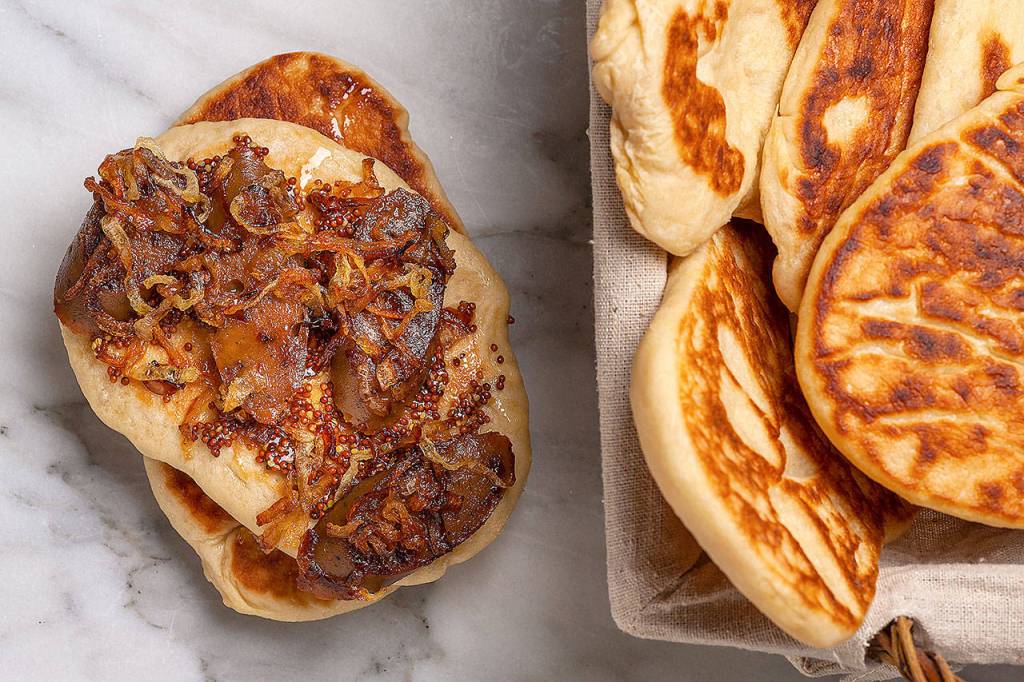 Beer is a great choice to use in making flatbread, because it instantly adds even more yeasty goodness. (Photo by Goran Kosanovic for The Washington Post)