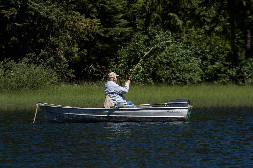 Pat ONeil of Everett fights a nice rainbow trout in Leech Lake. (Mike Benbow photo)