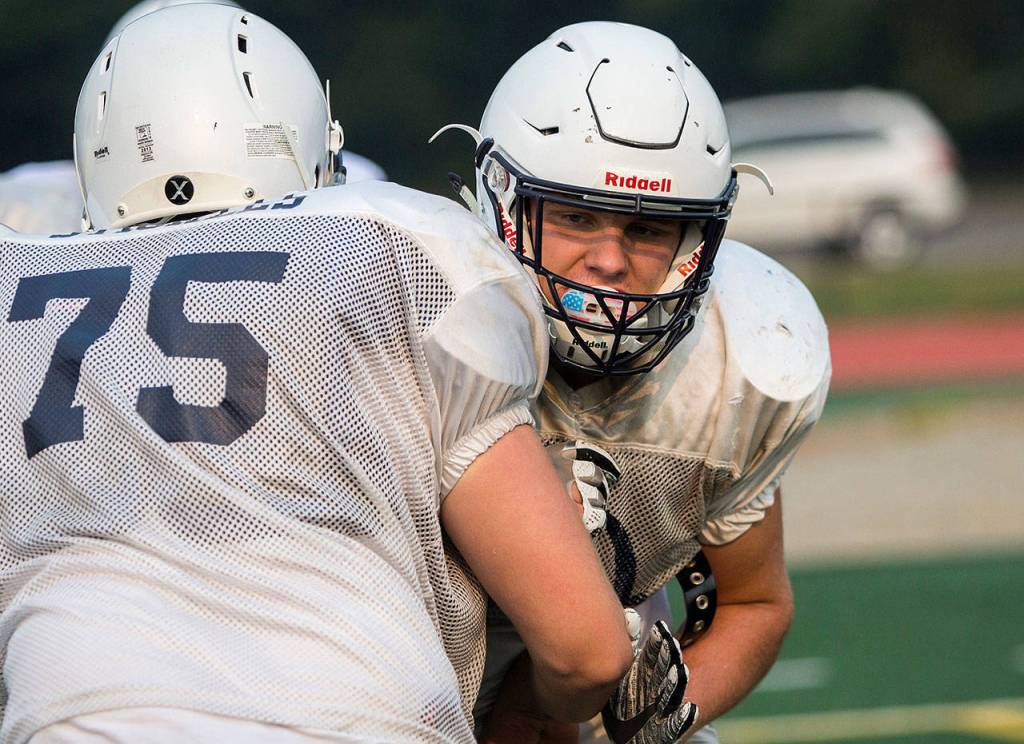 Tyler Deason participates in a blocking drill during Sultan High Schools Aug. 22 football practice. (Olivia Vanni / The Herald)