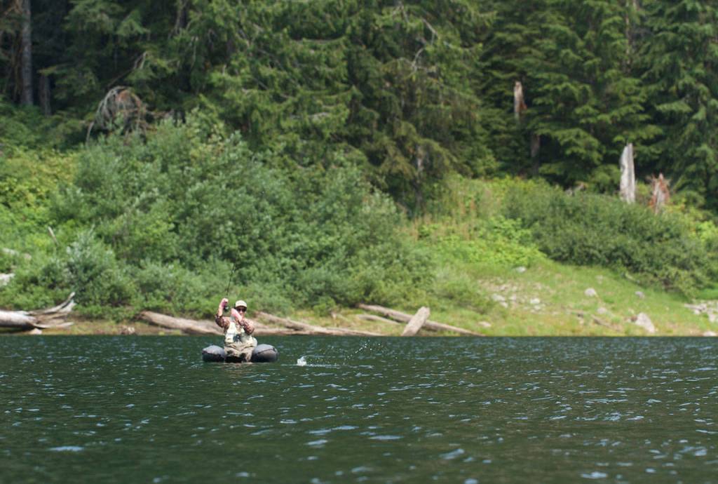 Anna Oenbring of Granite Falls fights a nice cutthroat at the 30-acre Slide Lake. (Mike Benbow photo)