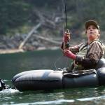 Anna Oenbring of Granite Falls enjoys fighting a jumping cutthroat at Slide Lake. (Mike Benbow photo)