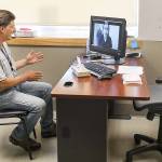 Curtis Letzkus checks in with a practitioner over the internet during his appointment at Ideal Option. (Lizz Giordano / The Herald)