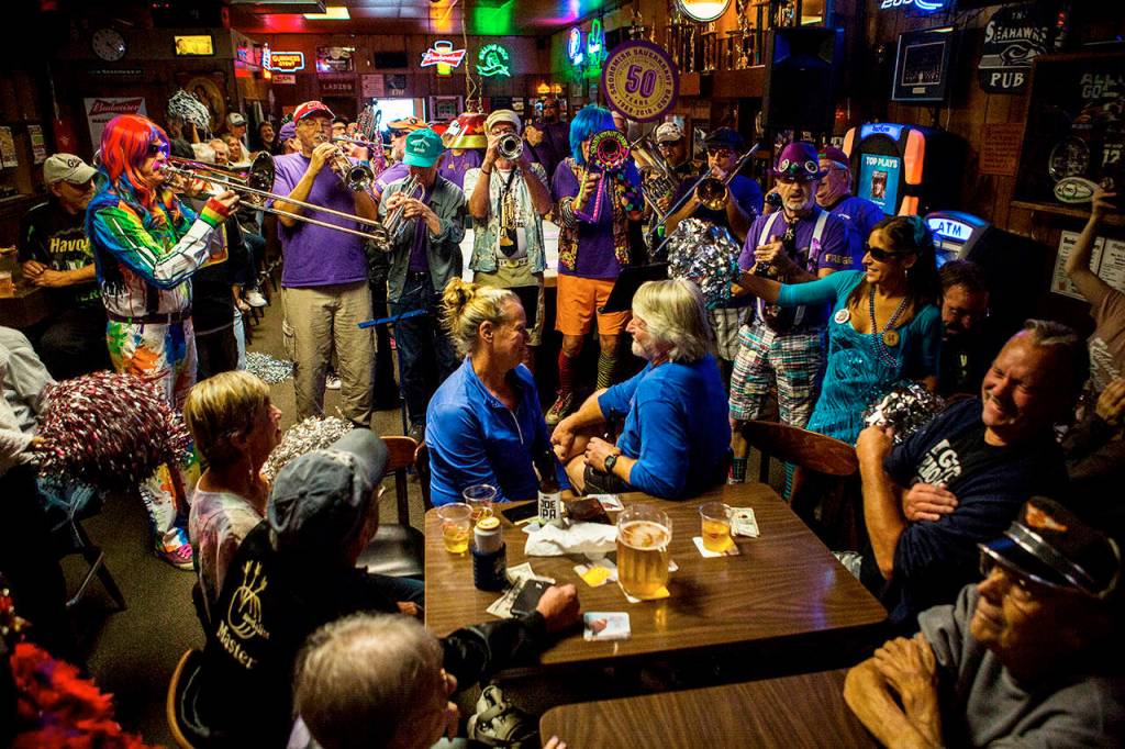 Patrons enjoy the Sauerkraut Band during the Kuhnles Tavern 100th year celebration Saturday in Marysville. (Olivia Vanni / The Herald)