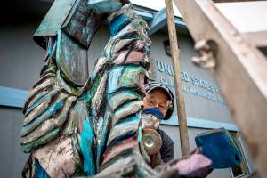 Meet the man behind the junk mail statue at the post office