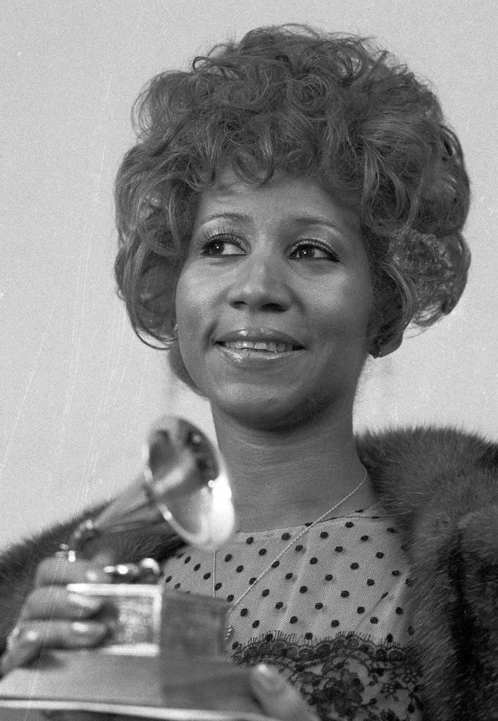 In this 1972 photo, Aretha Franklin holds her Grammy Award for Best Rhythm and Blue performance of the song Bridge Over Troubled Waters, in New York. (AP Photo/Dave Pickoff, File)