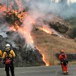 Firefighters monitor flames at a California wildfire. (Photo courtesy of Ernie Walters)