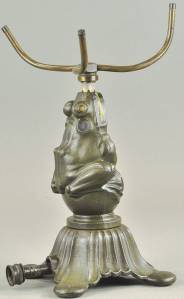 This iron frog sits on a ball on a curvy base while balancing a sprinkler on his nose, waiting to water the lawn. The rare figure, even though repainted, auctioned for $780 at a Bertoia auction in June of last year.