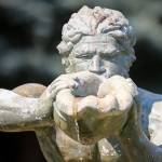 A European style fountain, multiple outbuildings and lawn sculptures dot the landscape of the old Silvana Schoolhouse. (Kevin Clark / The Herald)