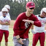 Cascade coach Jordan Sieh instructs his players during a practice on Aug. 16, 2018, at Cascade High School in Everett. (Kevin Clark / The Herald)