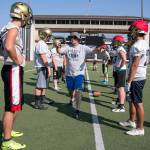 Everett head coach David Coldiron instructs his players during a practice on Aug. 17, 2018, at Everett Memorial Stadium. (Kevin Clark / The Herald)