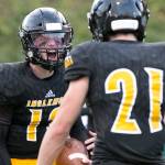 Inglemoors Mack Heaton (left) celebrates his rushing touchdown with Inglemoors Jake Dick Thursday night at Pop Kenney Stadium in Bothell on August 30, 2018. Inglemoor won 29-28. (Kevin Clark / The Herald)