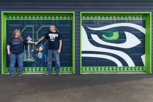 Jonathan and Peggy Sharp show their Seahawks pride at home and on the road. (Kevin Clark / The Herald)