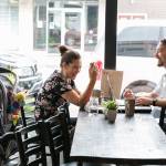 Kiersten Baiamonte, left, and Antonio Baiamonte enjoy coffee Friday morning at Moes Espresso in downtown Arlington on August 24, 2018. (Kevin Clark / The Herald)