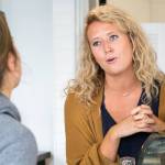 Kaitlyn Davis, owner, helps a customer Friday morning at Moes Espresso in downtown Arlington on August 24, 2018. (Kevin Clark / The Herald)