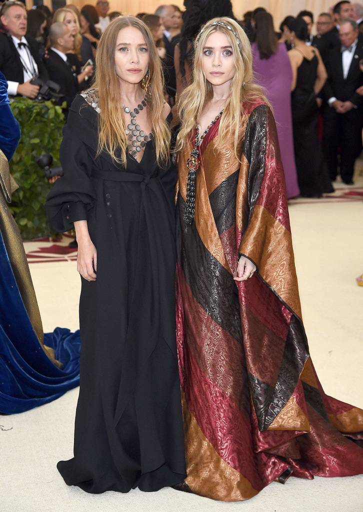 Mary-Kate Olsen, left, and Ashley Olsen attend The Metropolitan Museum of Arts Costume Institute benefit gala celebrating the opening of the Heavenly Bodies: Fashion and the Catholic Imagination exhibition on May 7 in New York. (Evan Agostini/Invision)