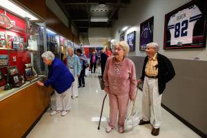 As they stroll past trophy cases, down hallways connecting Snohomish High Schools athletic facilities, a small group of 1942 graduates appear more than a little impressed Tuesday with the quality and quantity of honors Snohomish High students have accumulated. (Dan Bates / The Herald)