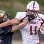 Everetts Ryan Sphung tackles and is penalized for a face mask on Cascades Max Nelson Friday night at Everett Memorial Stadium in Everett on August 31, 2018. Cascade won 32-22. (Kevin Clark / The Herald)