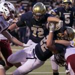 Everetts Christian Balmer bulls for a touchdown with Cascades Cameron Wheeler attempting a stop Friday night at Everett Memorial Stadium in Everett on August 31, 2018. Cascade won 32-22. (Kevin Clark / The Herald)