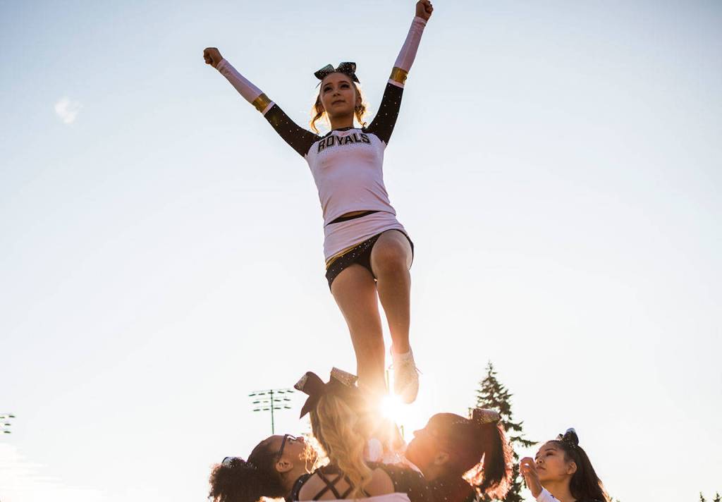 Lynnwood Royals cheer team practices during Fridays game against Nathan Hale on Aug. 31, 2018 in Edmonds, Wa. (Olivia Vanni / The Herald)