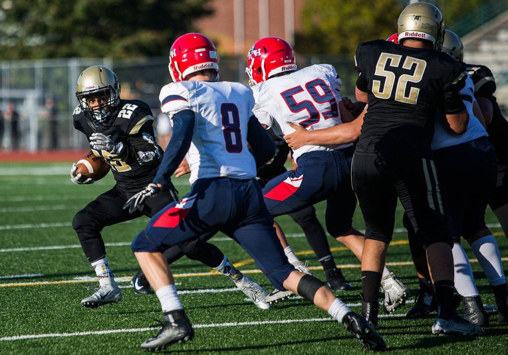 Lynnwoods Ali Al-Mayyahl runs the ball during Fridays game against Nathan Hale on Aug. 31, 2018 in Edmonds, Wa. (Olivia Vanni / The Herald)