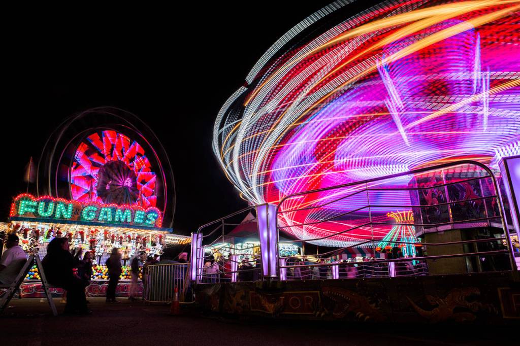 People enjoy the rides and games at the Evergreen State Fair on Sept. 1, 2018 in Monroe, Wa. (Olivia Vanni / The Herald)