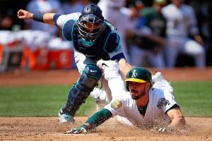 A’s beat Seattle 8-2 to increase their lead in wild-card race