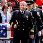 Ken Gaydos, a longtime police and fire department chaplain in south Snohomish County, leads a procession during the 2006 funeral for Charles Chuck Cain, a member of the Edmonds Fire Safety Foundation. Gaydos died Monday. He was 79. (Herald file)