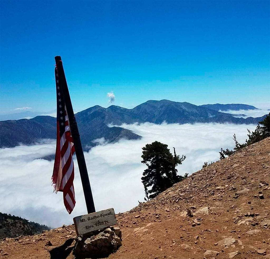 An American flag is planted at Mount Baden-Powell, a peak of over 9,000 feet along the Pacific Crest Trail. (Photo Devin Boyd)