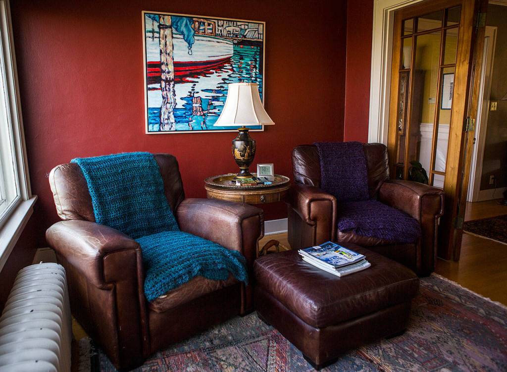 Two large leather chairs in a sitting room at Marlies Egberding and Ritch Sorgens home on Sept. 5 in Everett. (Olivia Vanni / The Herald)