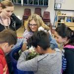 Eagle Creek Elementary summer camp students select vegetables that were grown at the school this past year. A garden was grown at the school to teach students about the growing process. (Contributed photo)