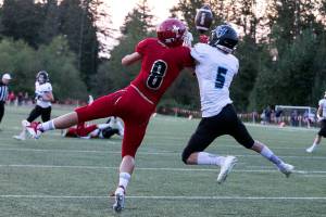 Hockinsons Wyatt Jones (right) breaks up a pass intended for Archbishop Murphys Josh McCarron Thursday night at Archbishop Murphy High School in Everett on September 6, 2018. (Kevin Clark / The Herald)
