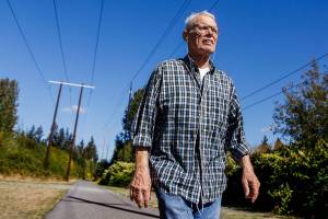Neil Hill, 80, enjoys his daily trek along the Interurban Trail in Lynnwood Monday. A missing link of the trail will open next week. (Dan Bates / The Herald)