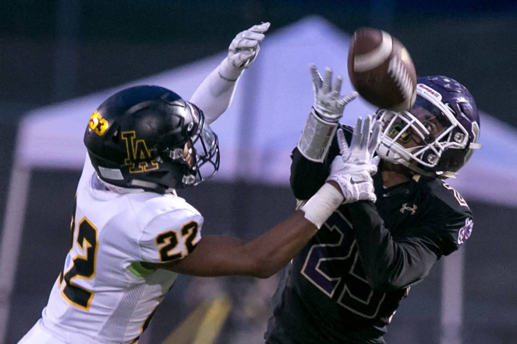 Lincolns Khalil Rogers forces an incomplete pass attempt to Lake Stevens Kasen Kinchen during a game on Sept. 7, 2018, at Lake Stevens High School. Lake Stevens win 38-21. (Kevin Clark / The Herald)
