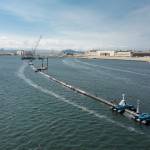 A long floating boom, shown here on Aug. 27, will be used to corral plastic litter in the Pacific Ocean is assembled in Alameda, California. Engineers will deploy the device on Sept. 8 between California and Hawaii in an attempt to clean up the worlds largest garbage patch. (The Ocean Cleanup via AP)
