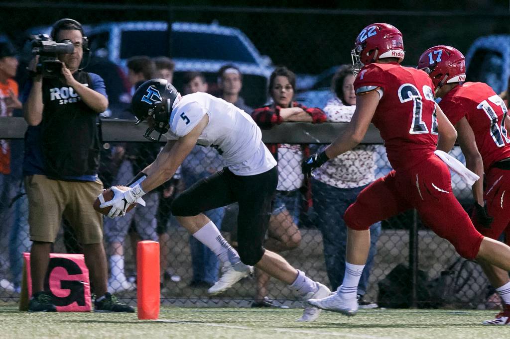 Hockinsons Wyatt Jones crosses the goal line for a touchdown with Archbishop Murphy trailing at Archbishop Murphy High School in Everett on Sept. 6, 2018. (Kevin Clark / The Herald)