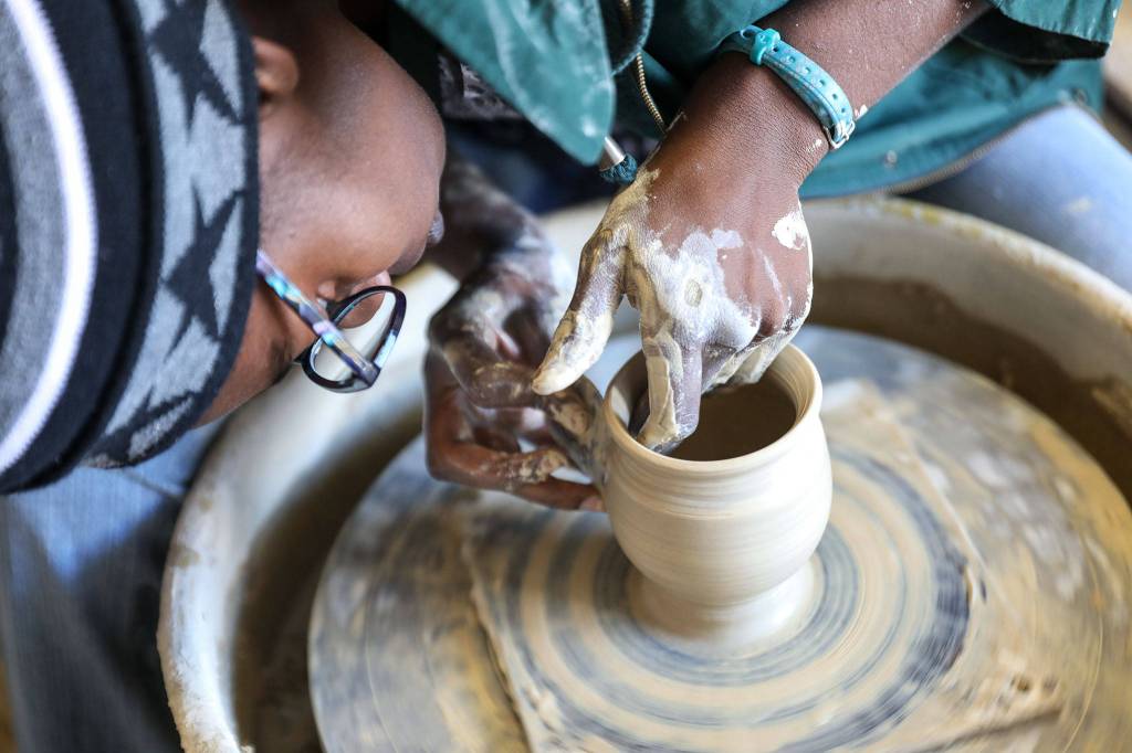 Akilah Spears, from Bruning Pottery Inc., shows off her skills Sept. 2 at the Makers Market hosted by the Evergreen State Fair. (Lizz Giordano / The Herald)